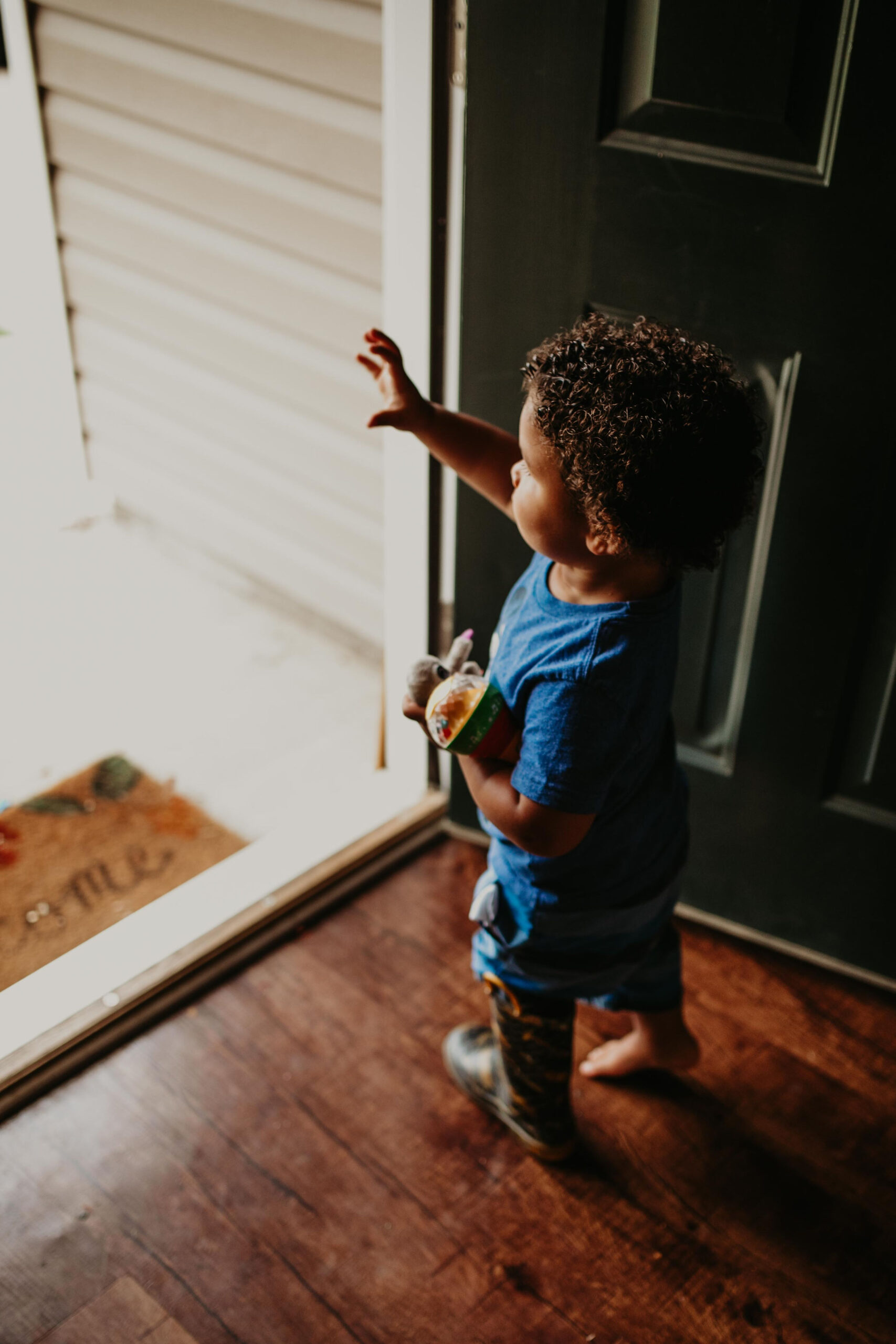 child standing in doorway