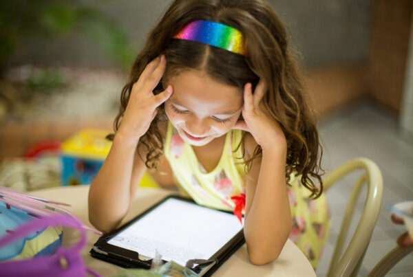young girl using ipad